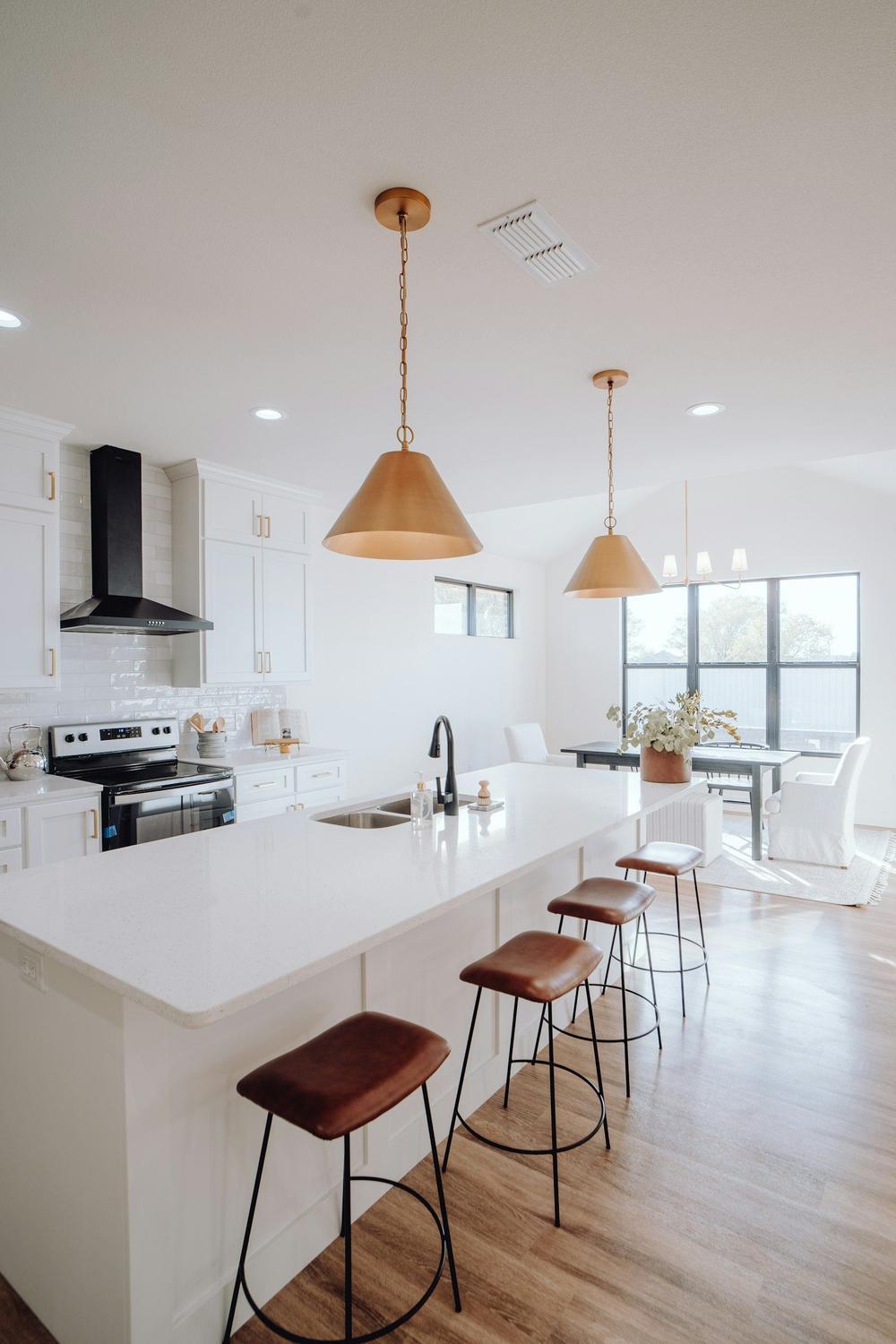 A bright rental kitchen with an island bench